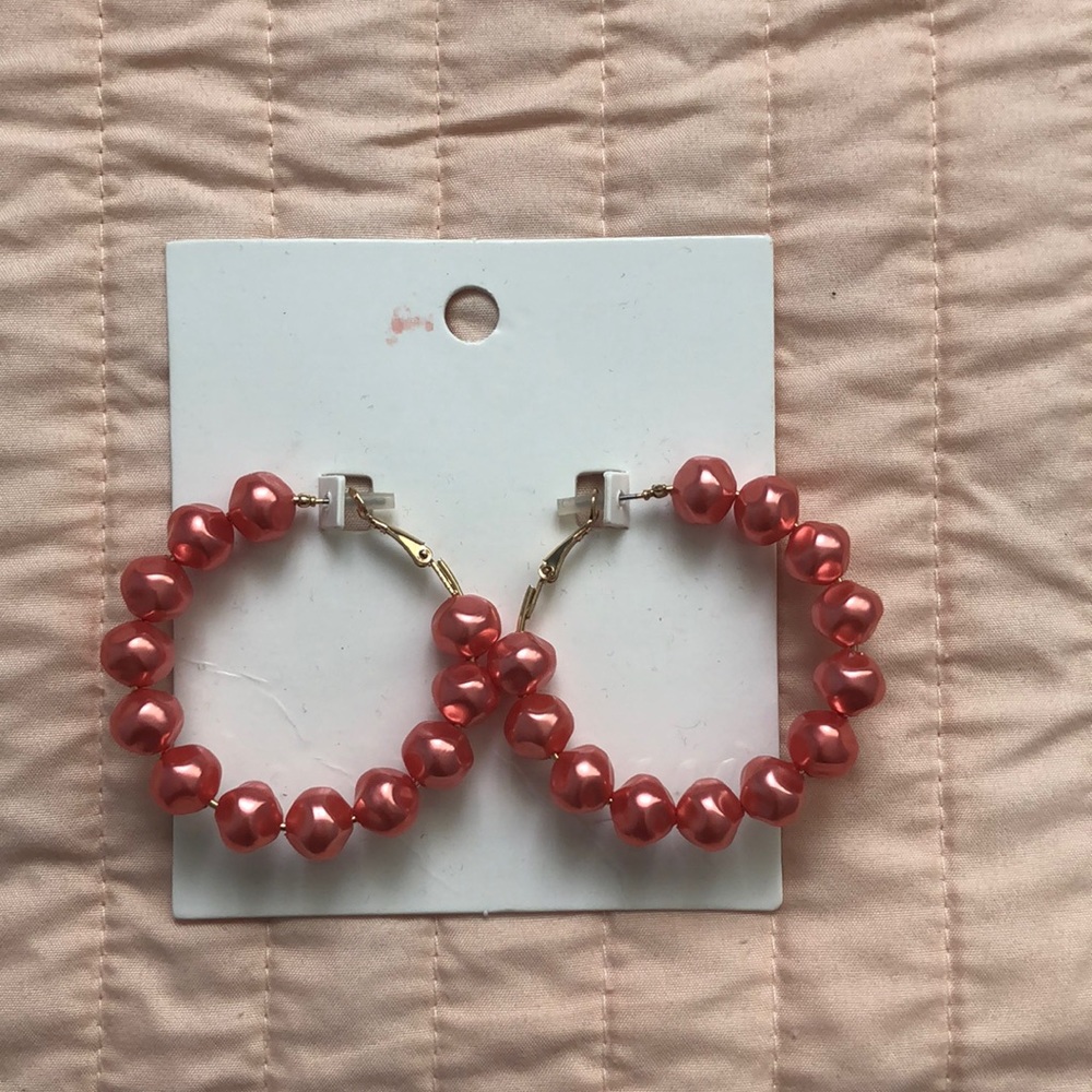 Large hoop pink beaded earrings